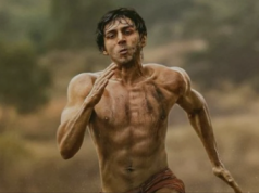 The first photo of Kartik Aaryan’s Chandu Champion shows off his well-defined abs while he sprints in Langot.